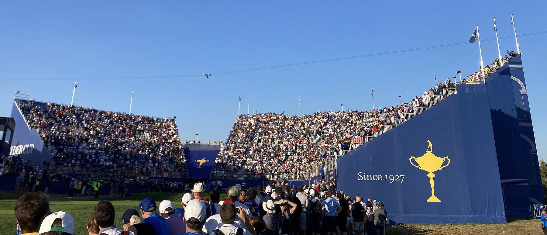 The first-tee grandstand at Marco Simone, Rome, with the Ryder Cup trophy and the words Since 1927